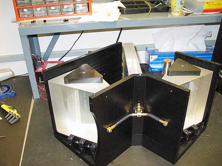 The optical device fully assembled with two triangles on top